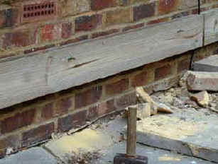 Ledger fixed to wall of house