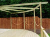 A curved pergola and deck at corner of house