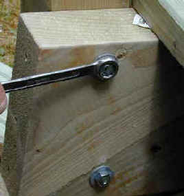 Two M12 galvanised bolts secure newel to decking staircase