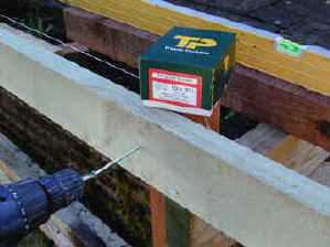 Deck joist being fixed to upright support