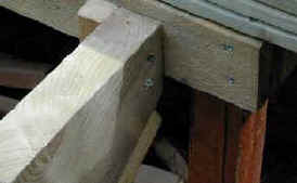 Top of staircase stringer fastened to the deck joists